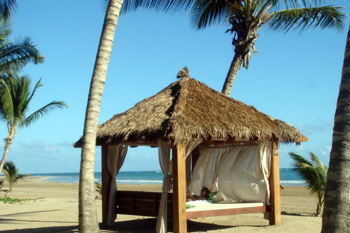 A palm-shaded beach cabana at Bahía Beach, Río Grande, Puerto Rico