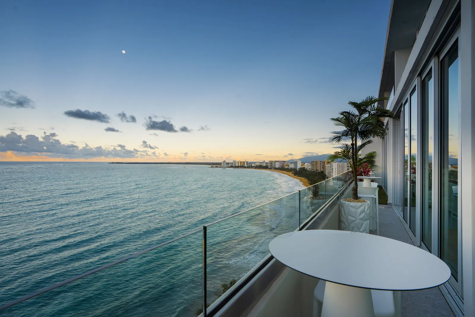 Balcony overlooking the ocean at sunset