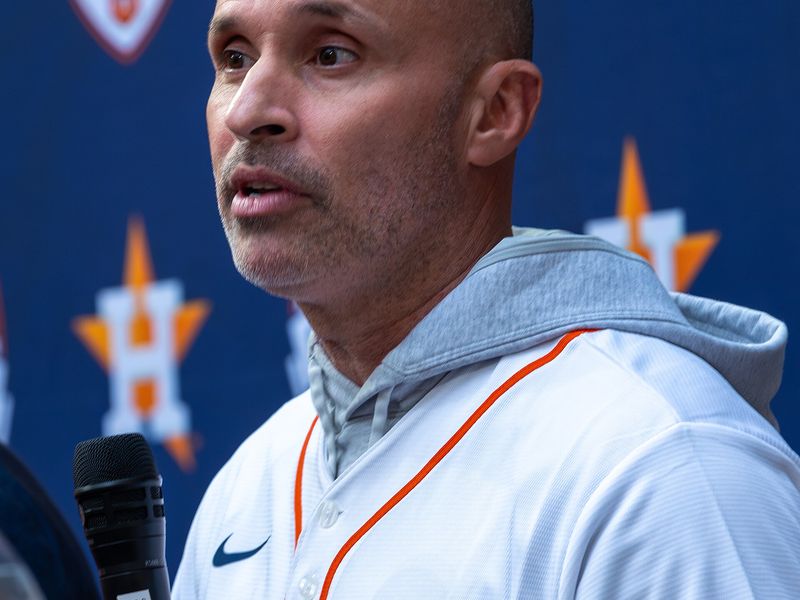 Joe Espada speaking into a microphone