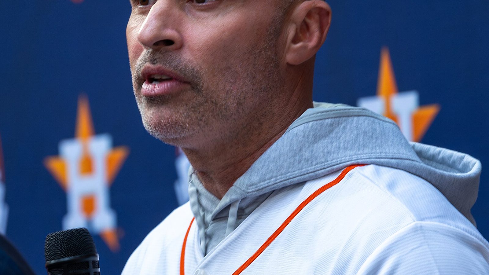 Joe Espada speaking into a microphone