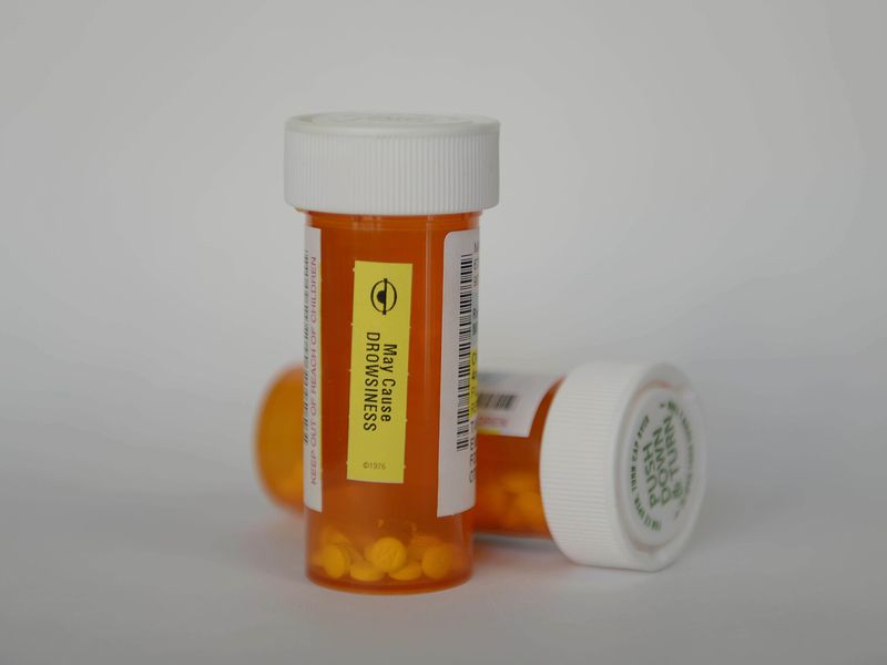DEA personnel collecting unused prescription medications during a National Prescription Drug Take Back Day event