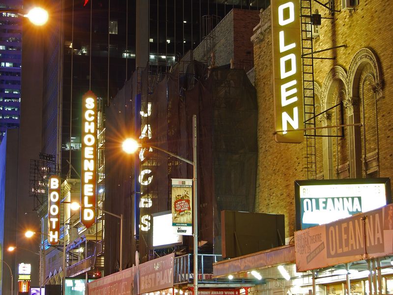 Nighttime view of Broadway theaters on West 45th Street including the Lunt-Fontanne Theater in New York City