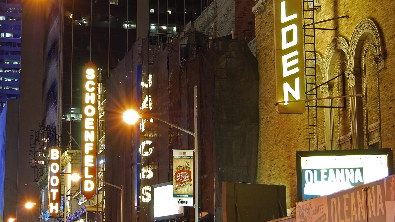 Nighttime view of Broadway theaters on West 45th Street including the Lunt-Fontanne Theater in New York City