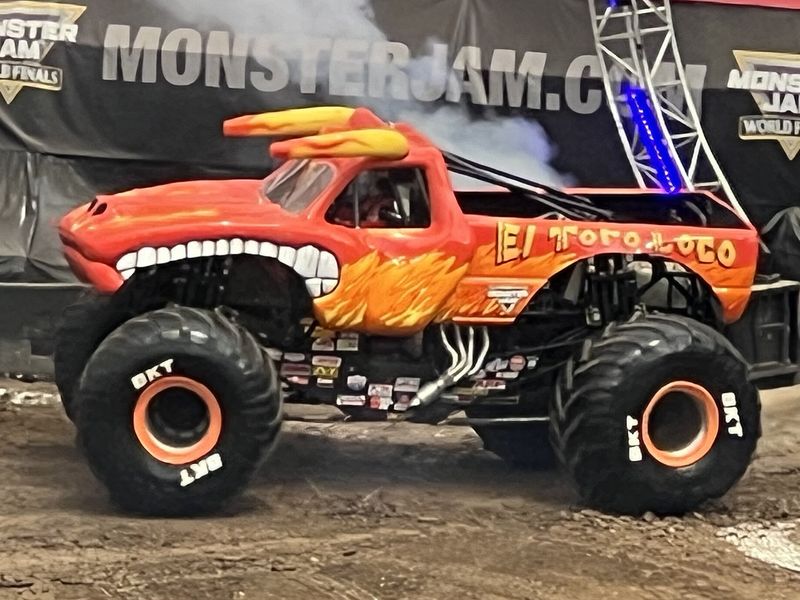 Armando Castro driving El Toro Loco monster truck performing a wheelie