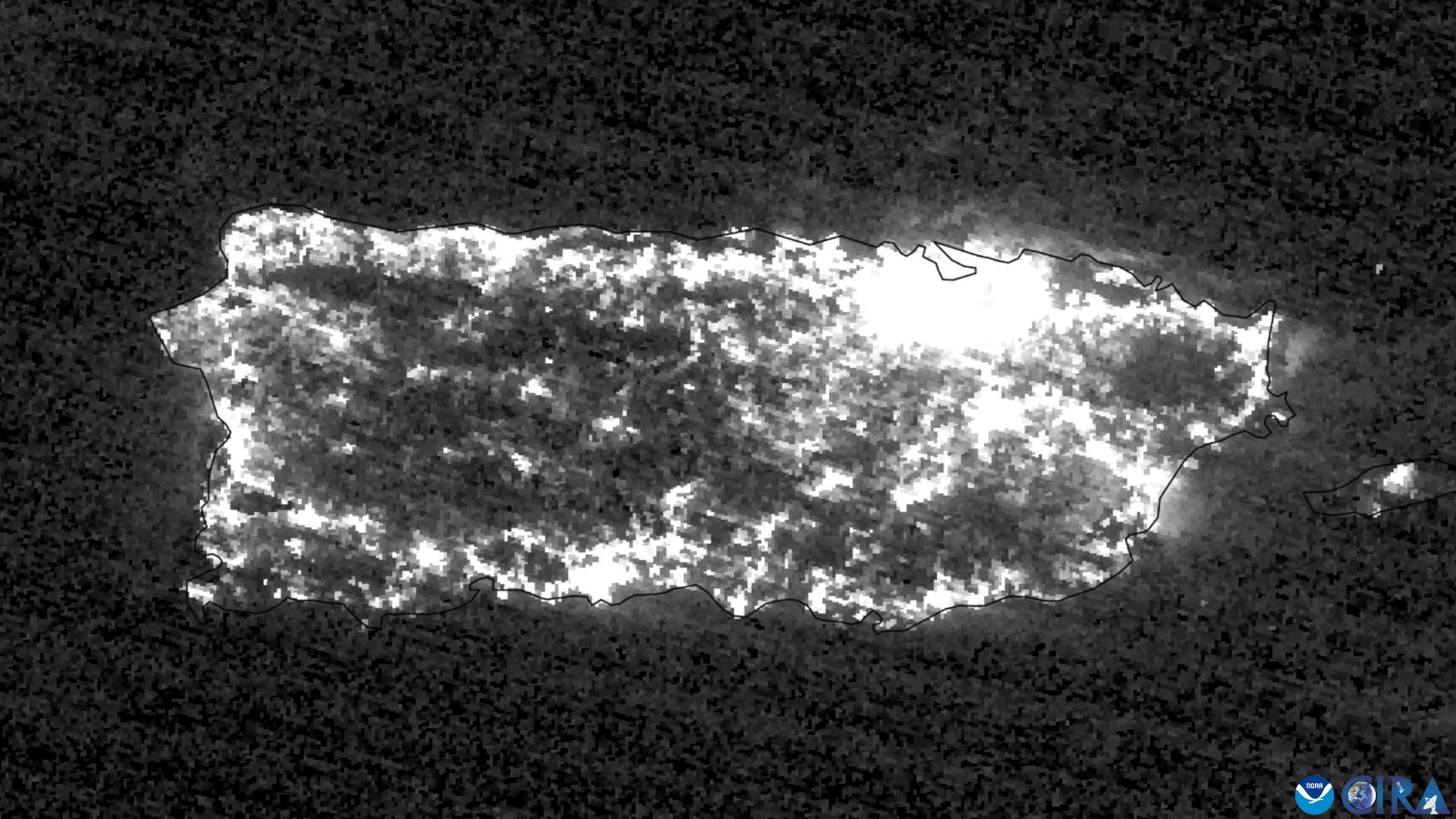 Satellite image of Puerto Rico at night showing widespread power outages