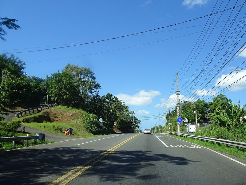 PR-111 highway in Moca, Puerto Rico, approaching an intersection while traveling west