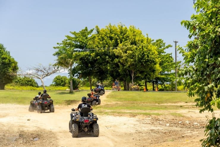 image of people riding in ATV