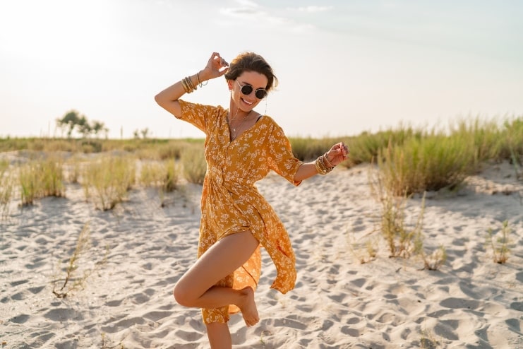 image of a happy woman wearing beach outfit