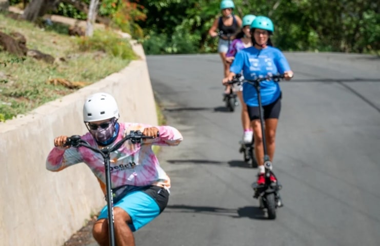 image of people using scooter