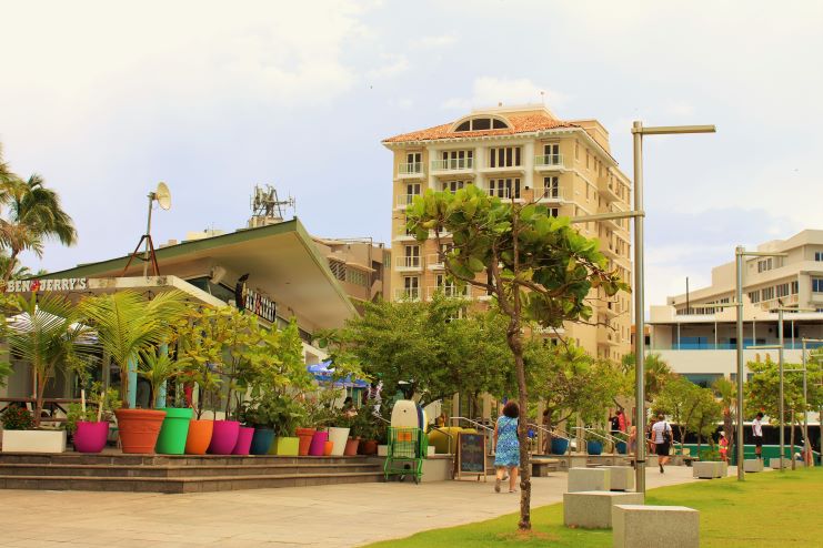 image of people walking along Condado