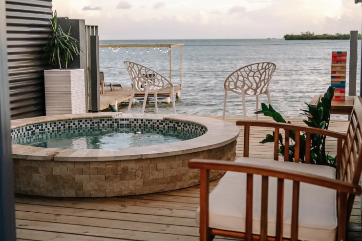 image of a deck with pool and ocean view