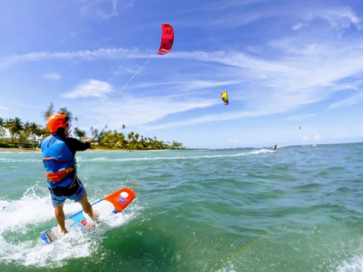 image of a guy kitesurfing in Dorado