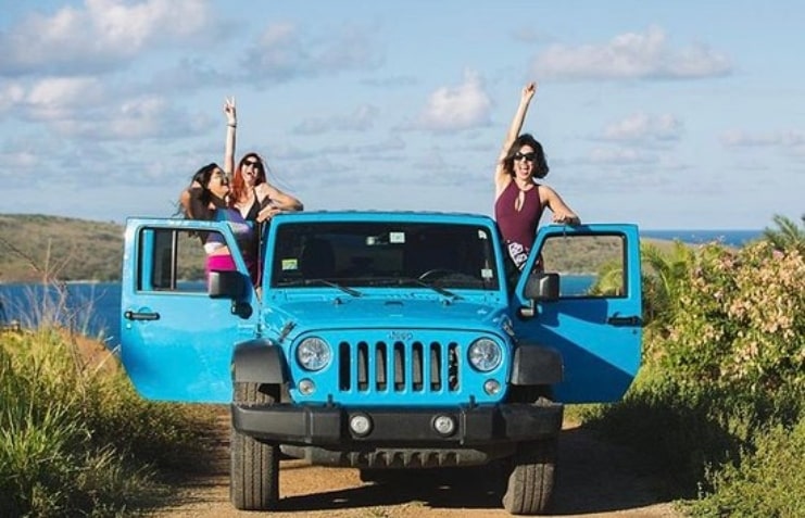 image of ladies riding Jeep