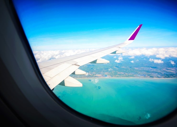 image of plane window with outside view