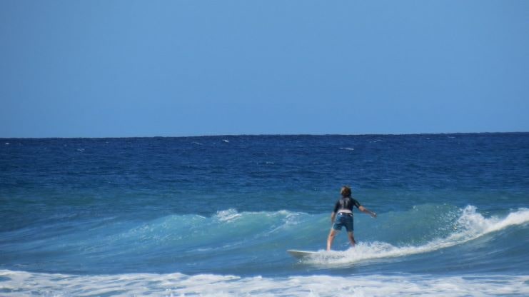 image of a kid surfing at Maria's Beach