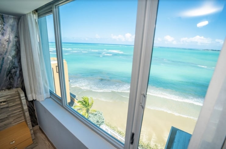 image of window with beach view