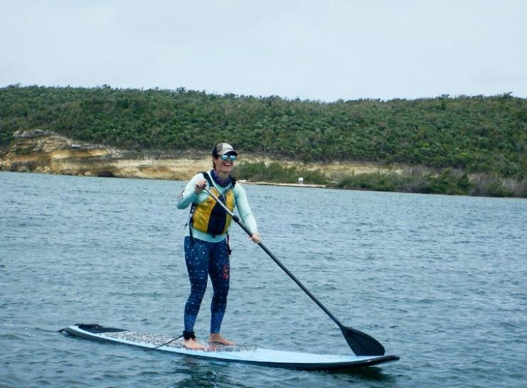 image of a girl paddle boarding in Vieques