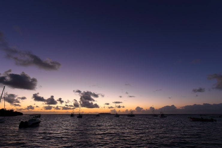 image of Silhouette of sailboats at sunrise