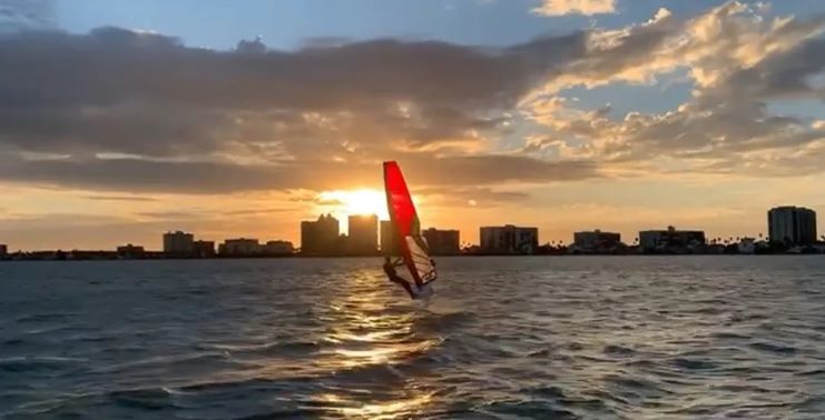 image of a guy windsurfing