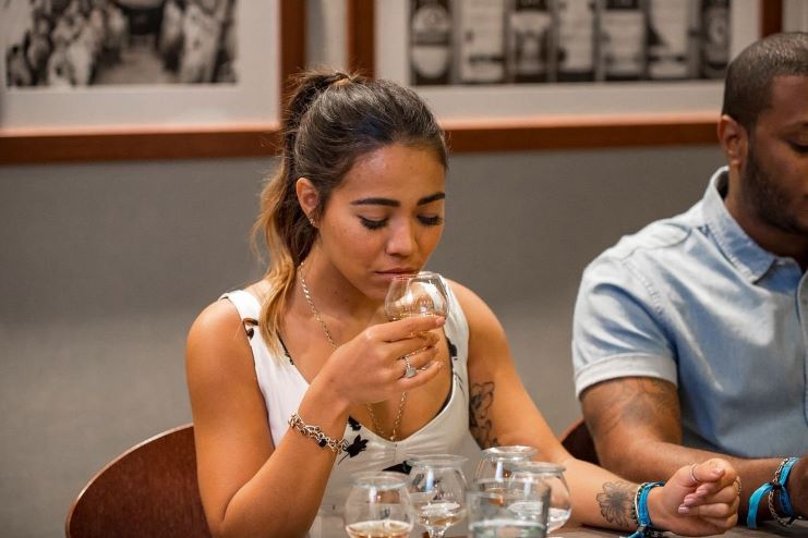 image of a girl tasting rum