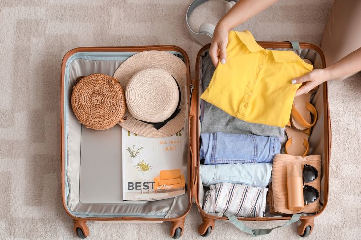 image of a girl packing for a trip