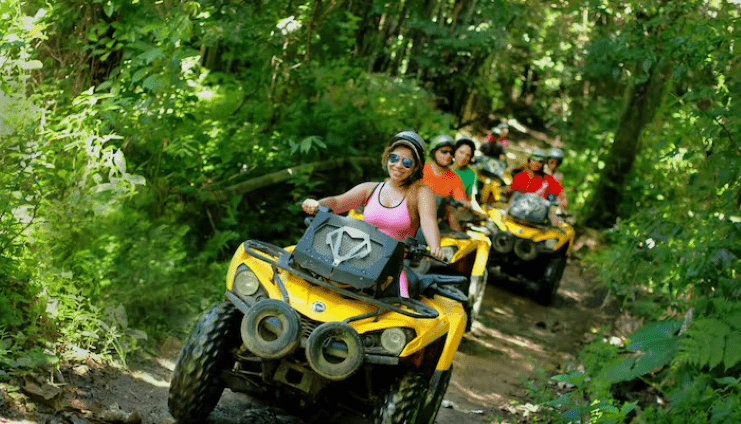 image of tourists riding an ATV