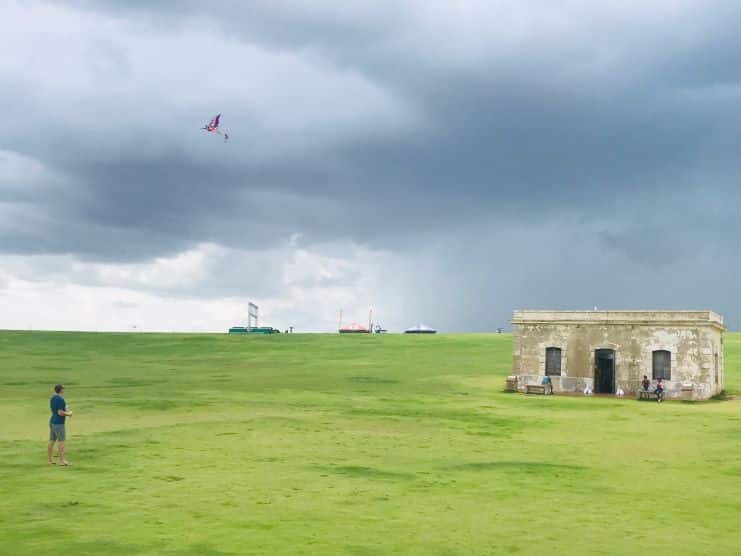 image of a guy flying a kite at El Morro