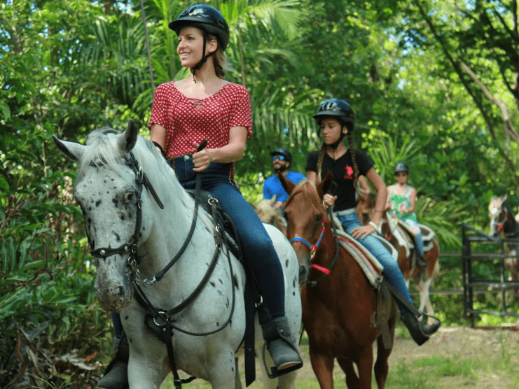 image of tourists riding a horse