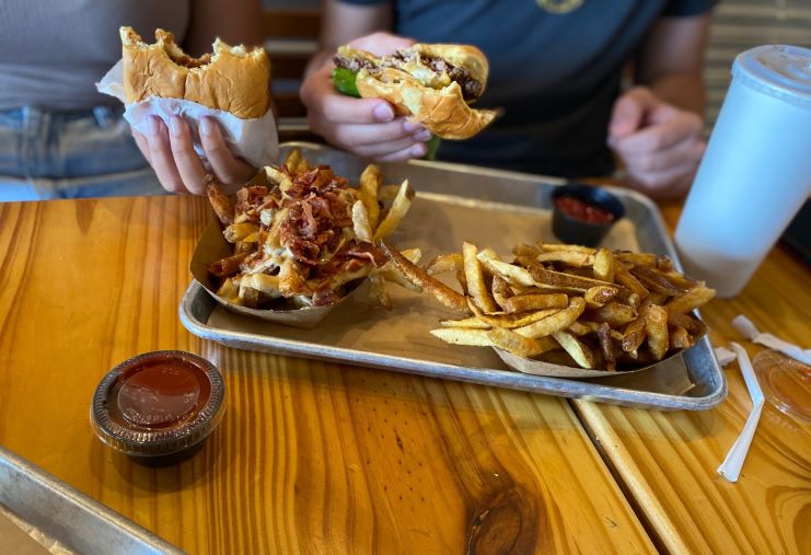 image of the kids enjoying Burger Social's burgers and fries