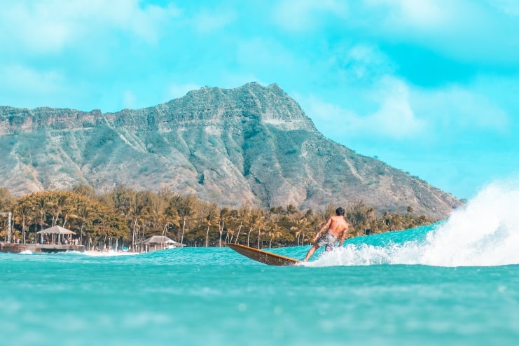 image of surfer riding a wave