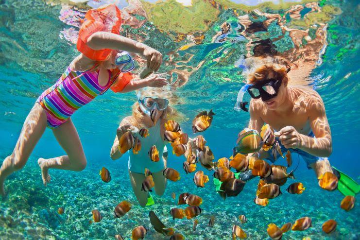 image of a family snorkeling in Maldives