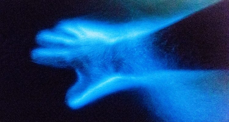 image of a glowing hand in the water